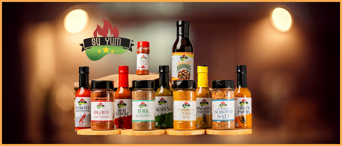 Complete lineup of Su Yum Unique Sauces including hot sauces and marinades displayed on rustic table